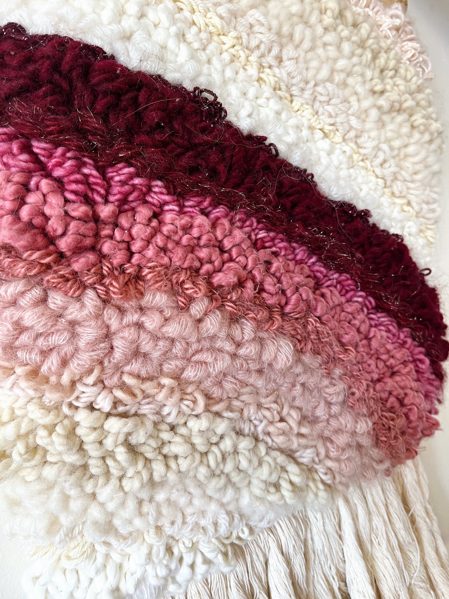 shades of pink and candlelight woven wall hanging